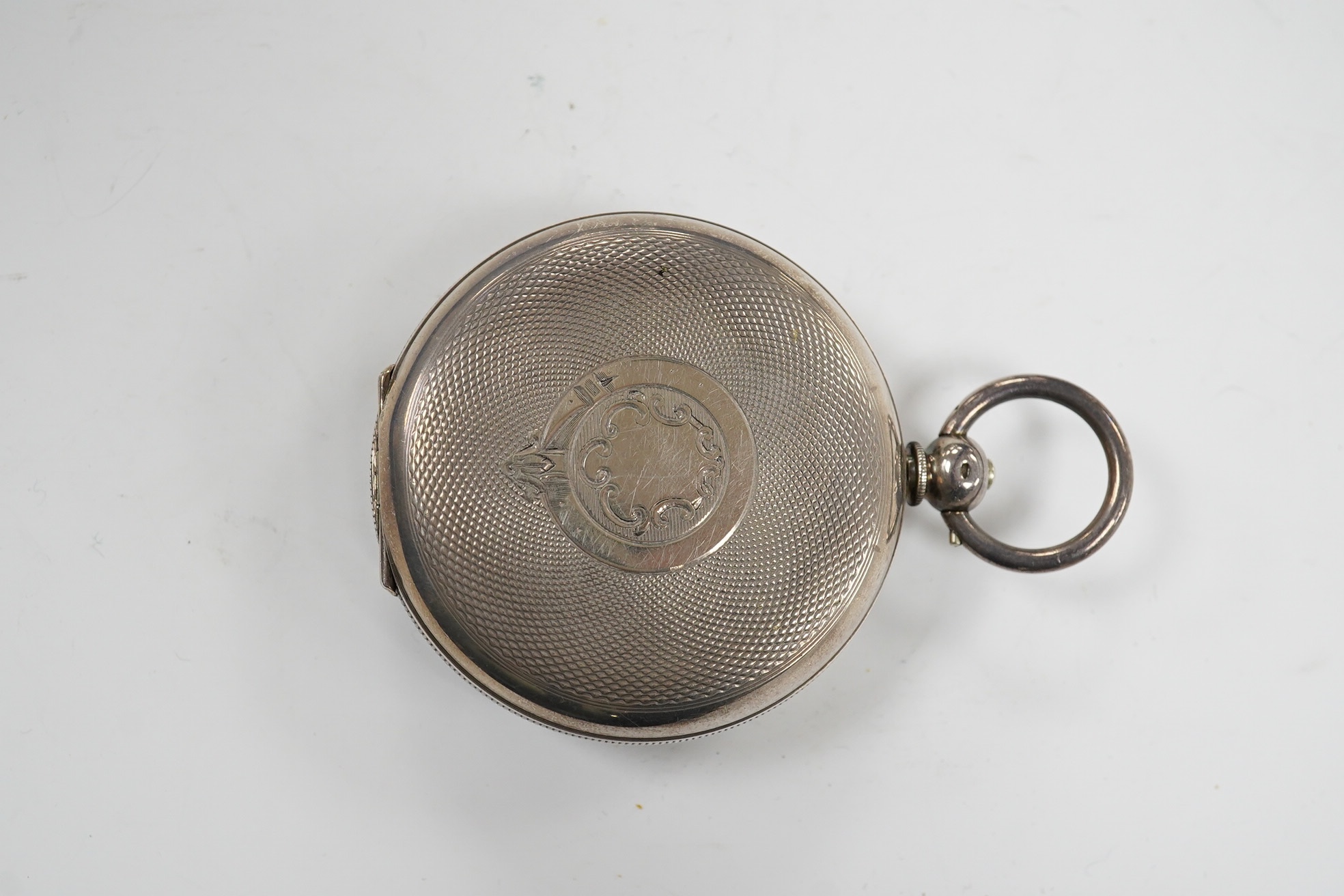A late 19th century engine turned Swiss 935 standard white metal key wind open faced pocket watch, with engraved inscription relating to J.B. Dent & Sons, London, case diameter 53mm. Condition - fair